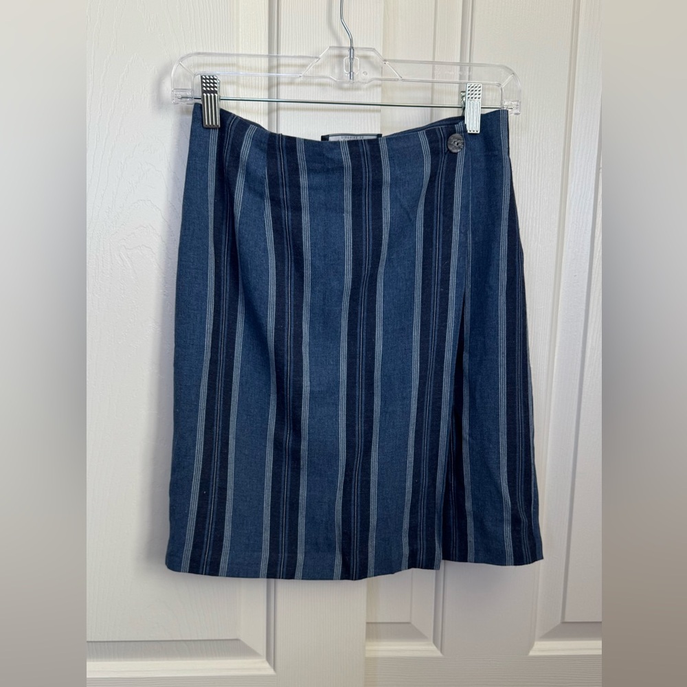 Mini wrap skirt, slightly above knees. In great condition.